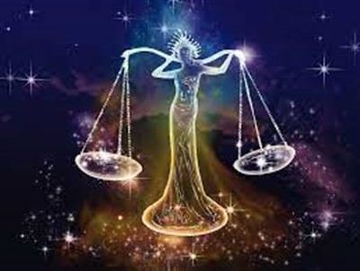 Goddess figure holding scales